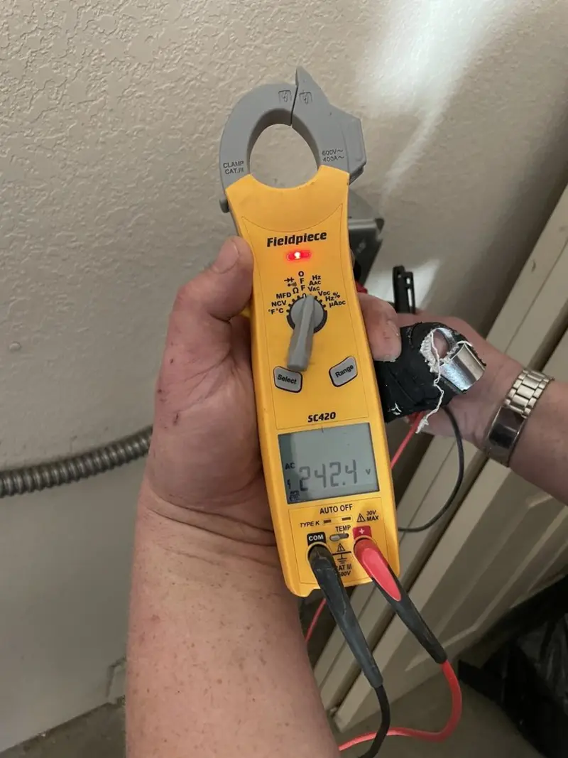 Voltage testing with clamp meter during Electrical Installation Services in Delaware
